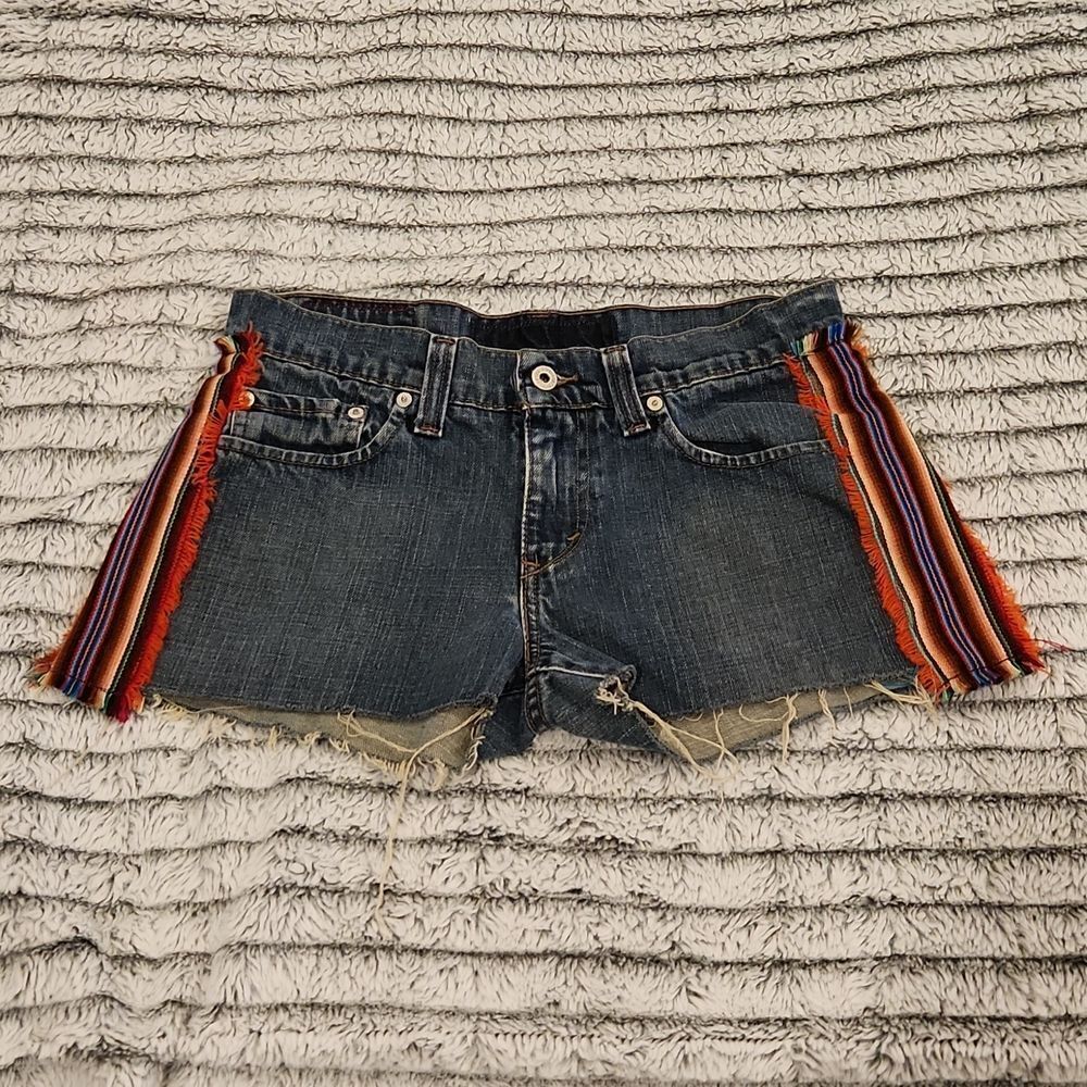 Dark blue upcycled Levi's jean shorts  with colorful side panels size 29.